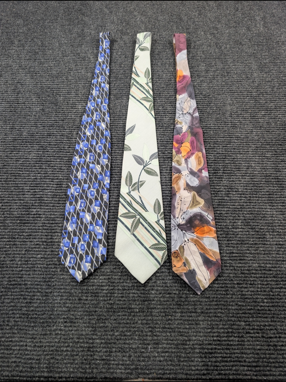 Avon Men's Tie Trio — Blue, Cream, and Multicolor Floral